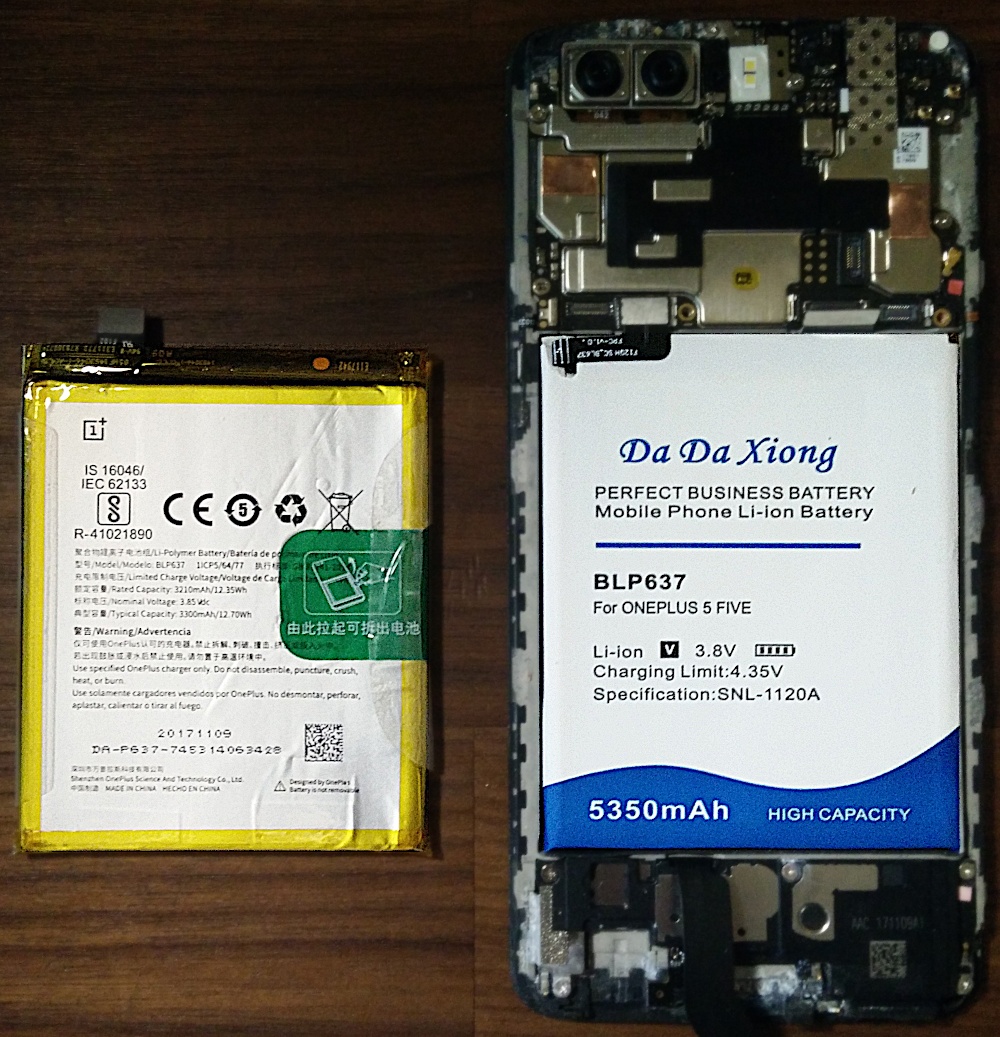 Photo of the OEM battery and the aftermarket battery side-by-side